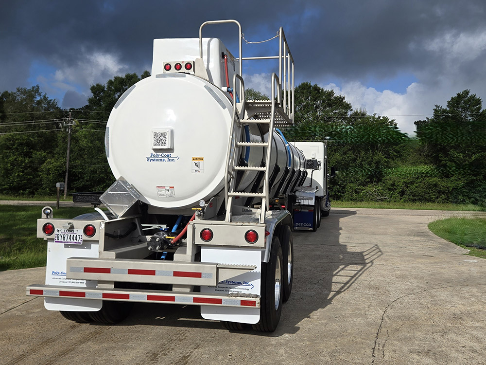 Stock tank trailer from Poly-Coat Systems connected to a truck for delivery.