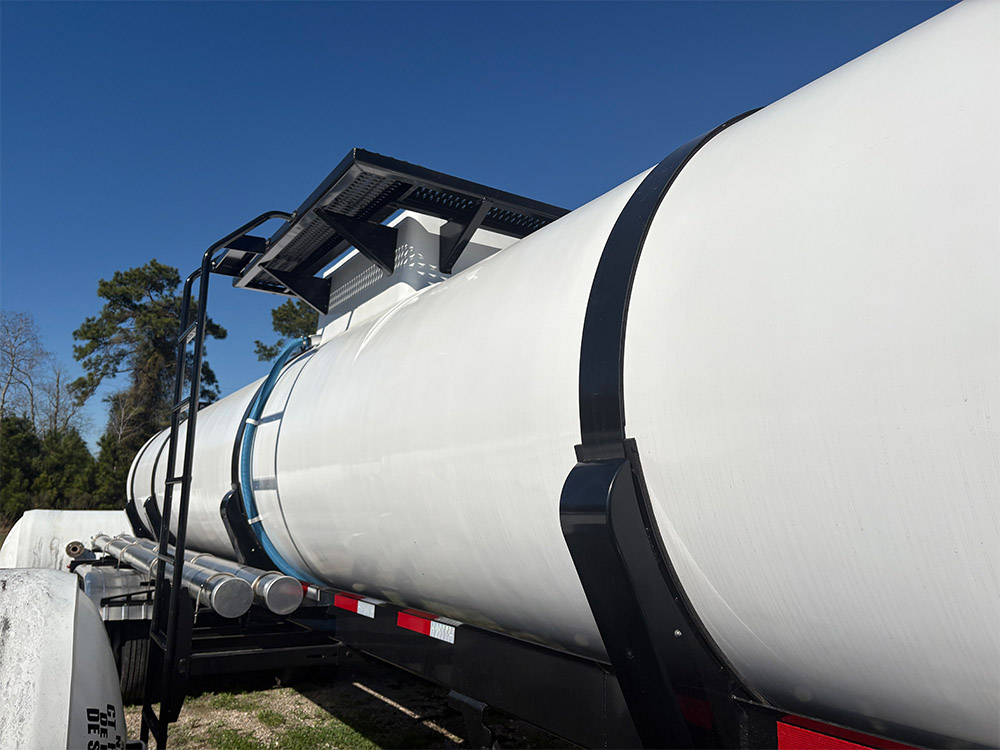 Stock tank trailer from Poly-Coat Systems featuring the ladder entrance.