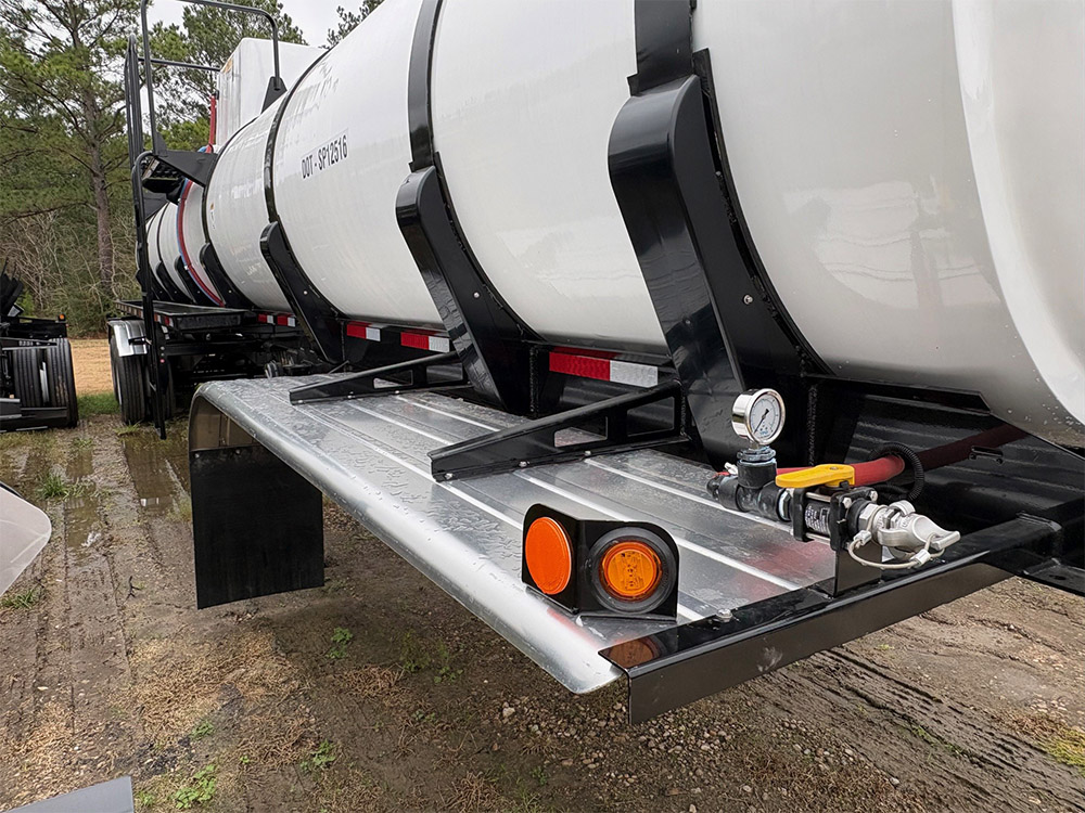 Vacuum tank trailer from Poly-Coat Systems showing the pressure gauge, valve assembly and side frame.